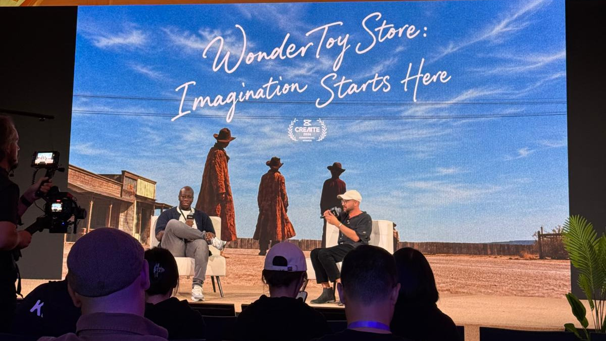 Victor Banya and Justin Hackney in conversation on stage at CapCut World Los Angeles, beneath the Wonder Toy Store title card.